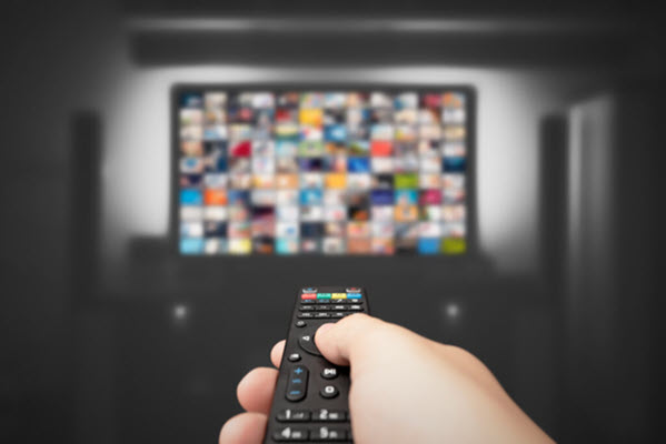 Remote control pointed at a TV