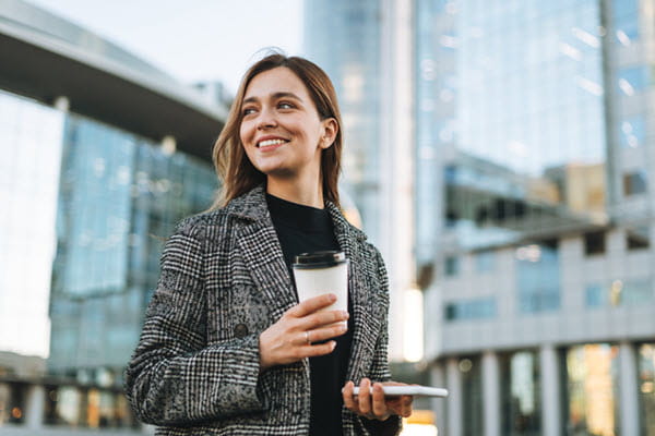 A professional young woman with coffee.