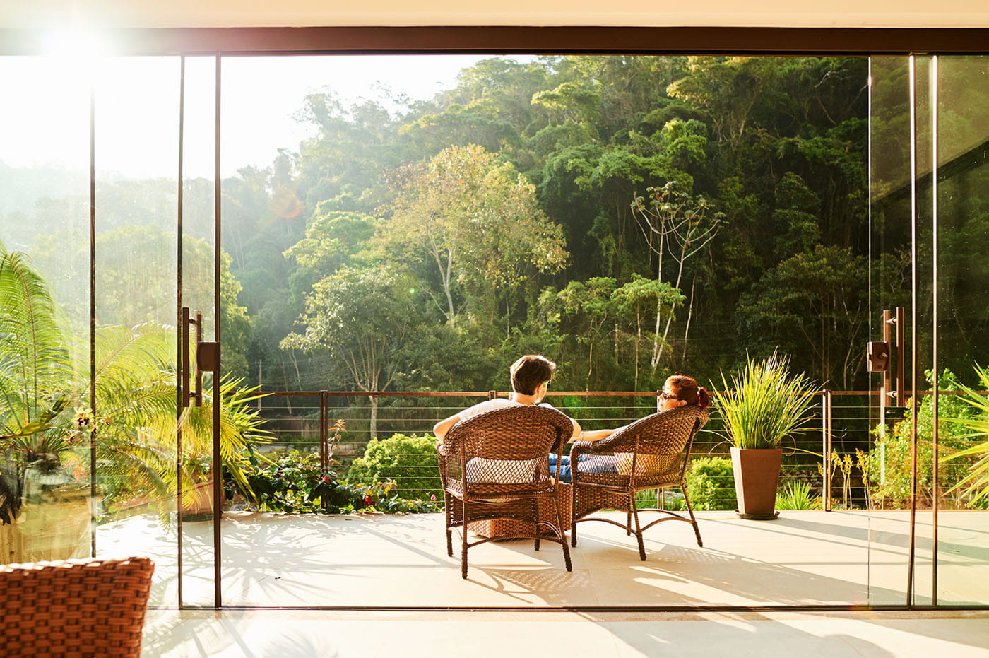 Two people relaxing on a tropical vacation.