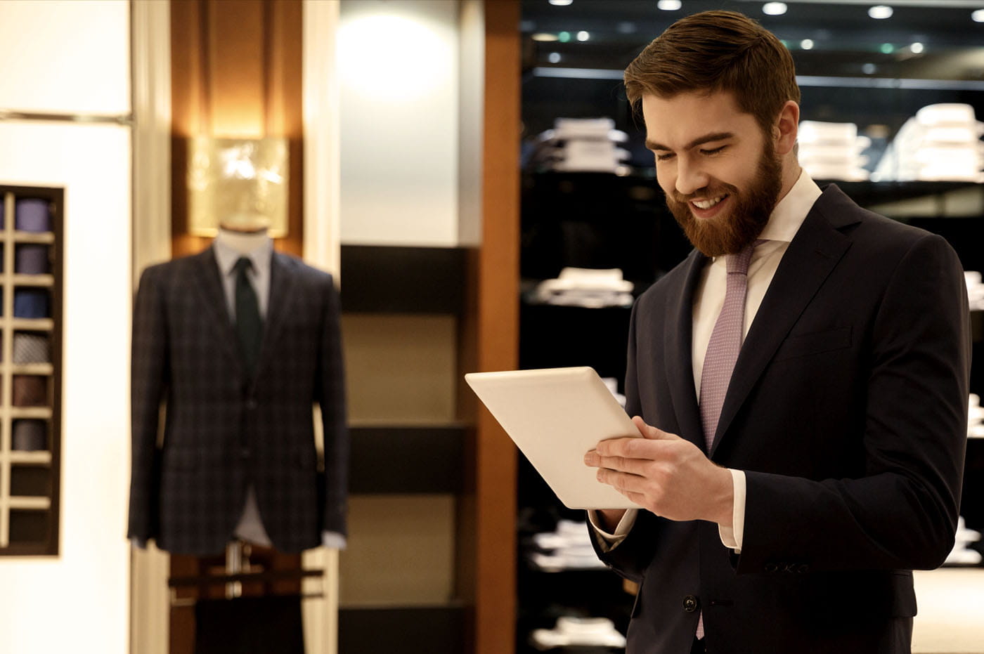 Man working at a suit shop