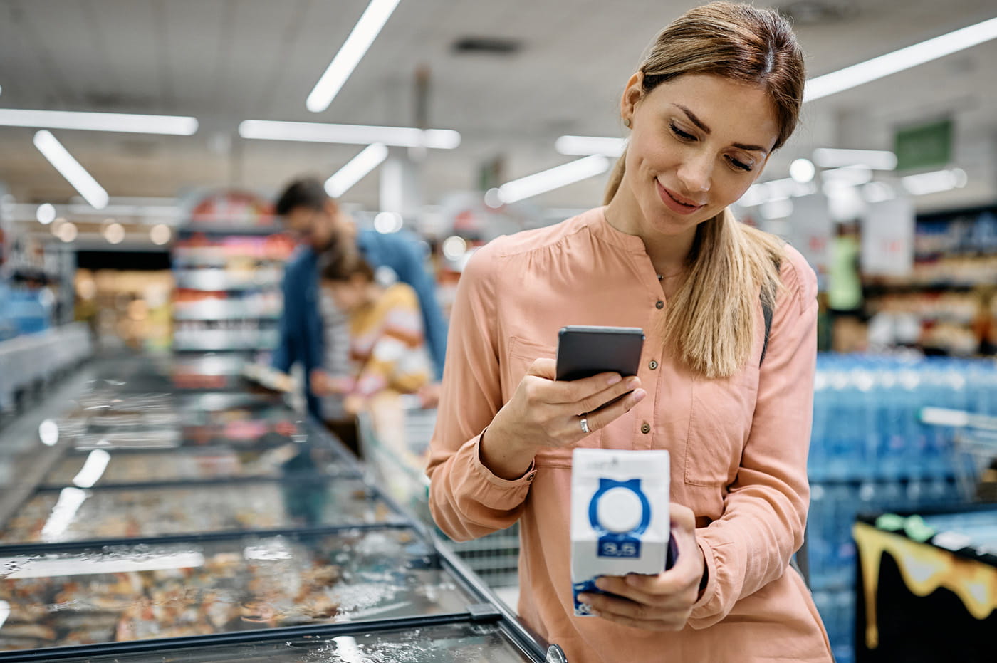 A woman grocery shopping.