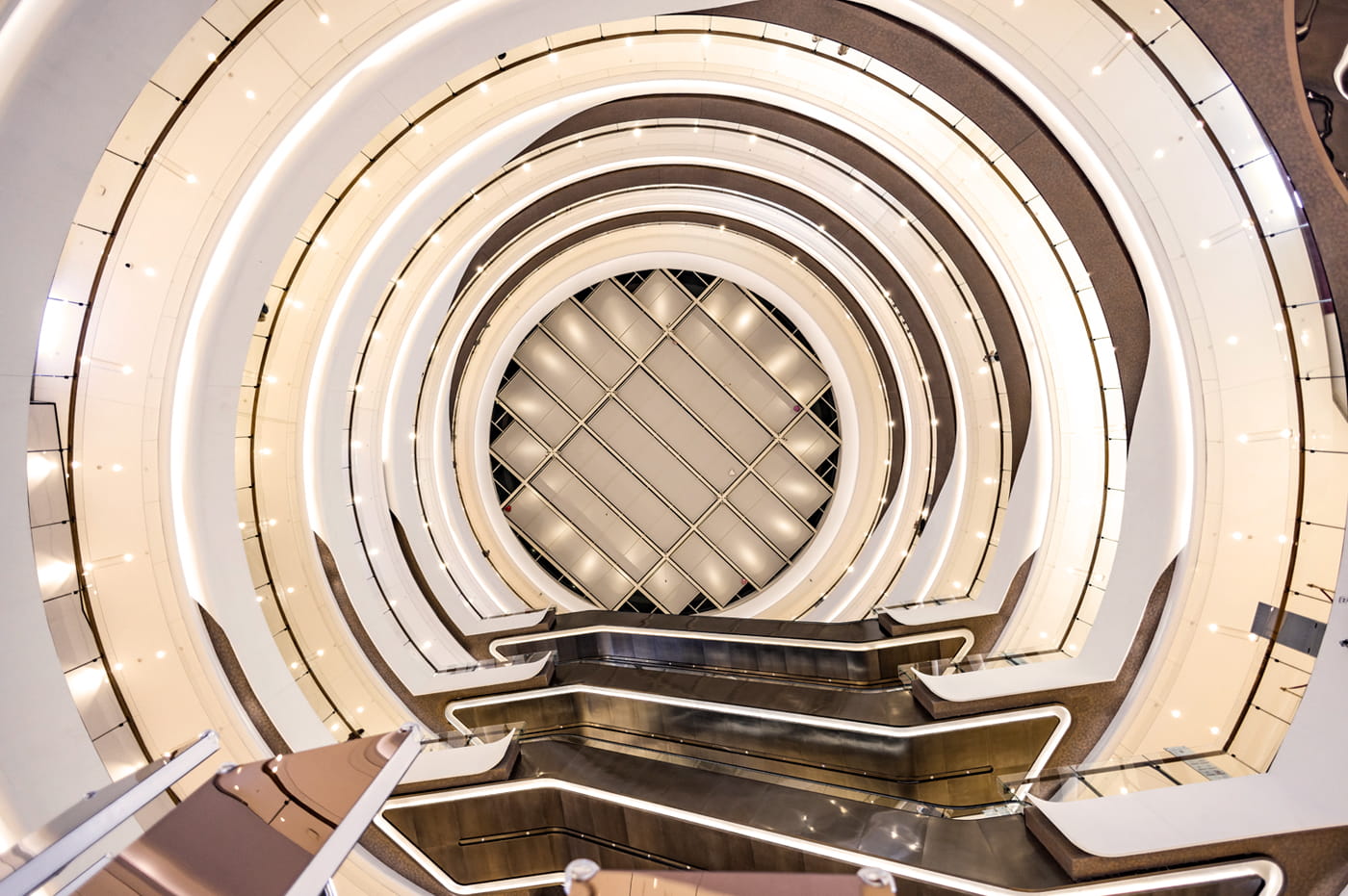 View up a spiral staircase in a luxury store.