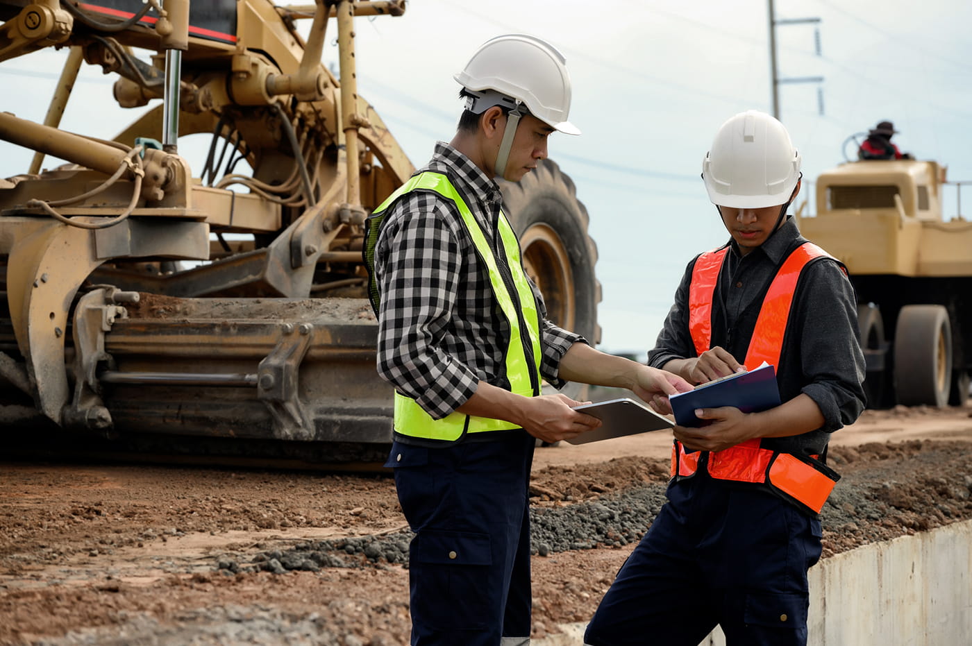 Workers in hardhats and safety vests.